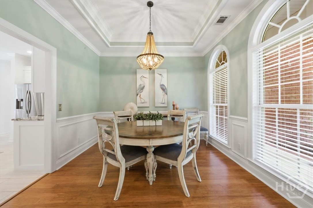 Dining room with beautiful tray ceiling.
