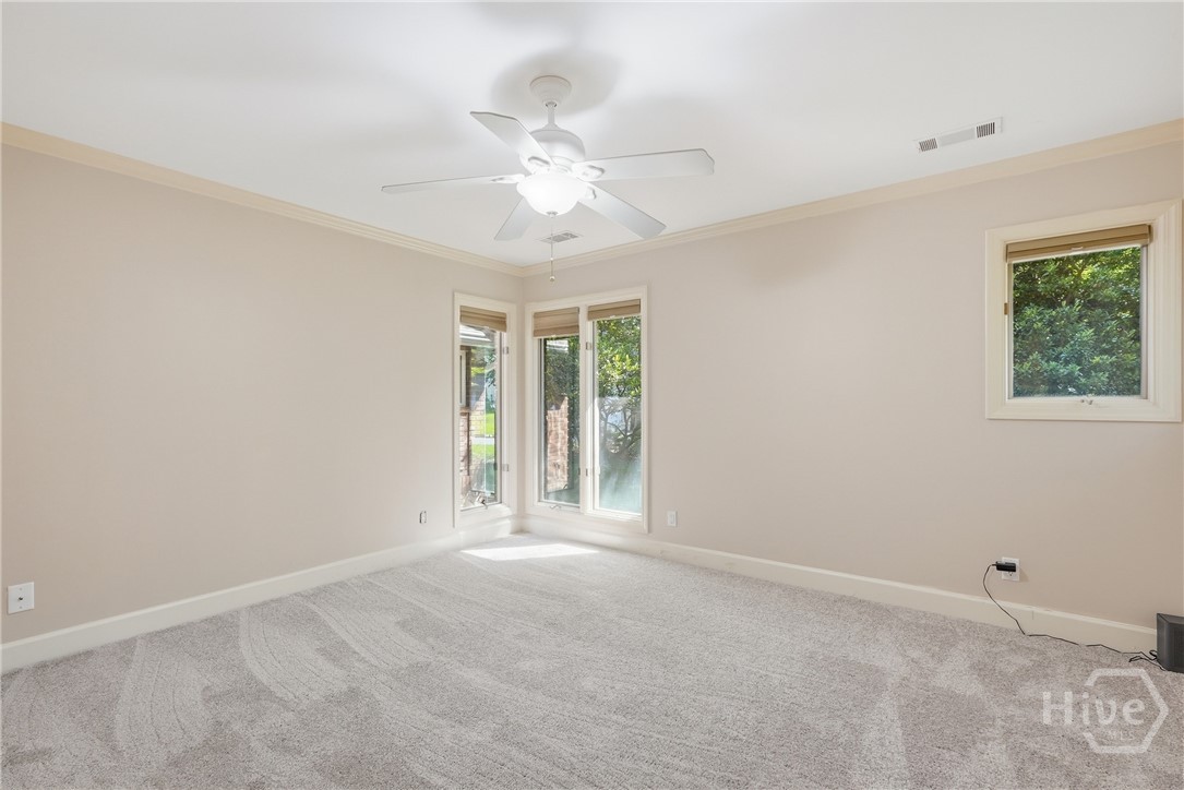 Guest bedroom at the end of the hallway from the primary suite. Also freshly painted and with new carpet.