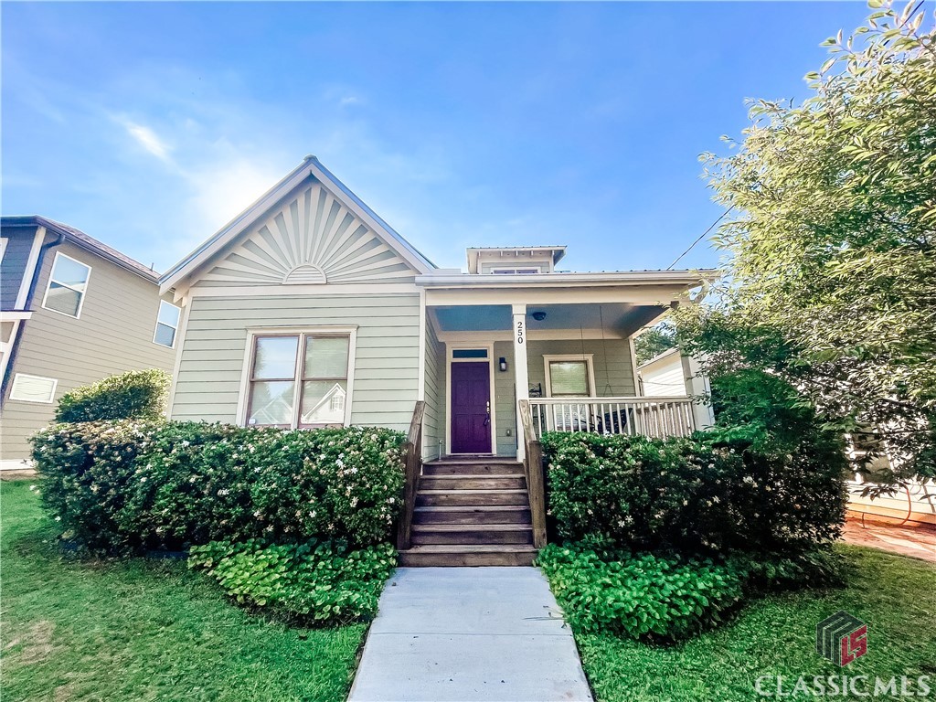 Charming in-town 1-story Cottage, built in 2008 by award-winning local builder J W York Homes, this home is currently being used as an Airb&b property and is being offered with its stylish furnishing. It was designed architecturally as a historic cottage reproduction, and features a metal roof, the front gable has a starburst pattern, a front porch with swing, and rear deck. Inside, the flooring is Oak, other than the the tile baths and laundry/mud room. The kitchen features cherry cabinetry, with polished concrete countertops, a large island, and stainless appliances, including gas stove. The common living area is open from front door to rear of house with excellent natural light. There's a generous primary bed/bath suite, as well as a secondary bed/bath. Off-street parking is located behind house, accessed from a rear alley. On the other side of the alley lies 7 acres of communal green space with open area for recreational use, like a mini-park, surrounded by woods which provide a privacy barrier. Behind this wooded barrier is Williams Farm, an urban farm and educational space owned by the Athens Land Trust. Also within 1 block is 5 acre woods, providing additional neighborhood green space. This location is only a few hundred feet off Ruth Street, which then provides a straight path into and thru the center of Downtown, ultimately ending at the UGA Arch and Historic North Campus. It's also only blocks from the Athens Loop.