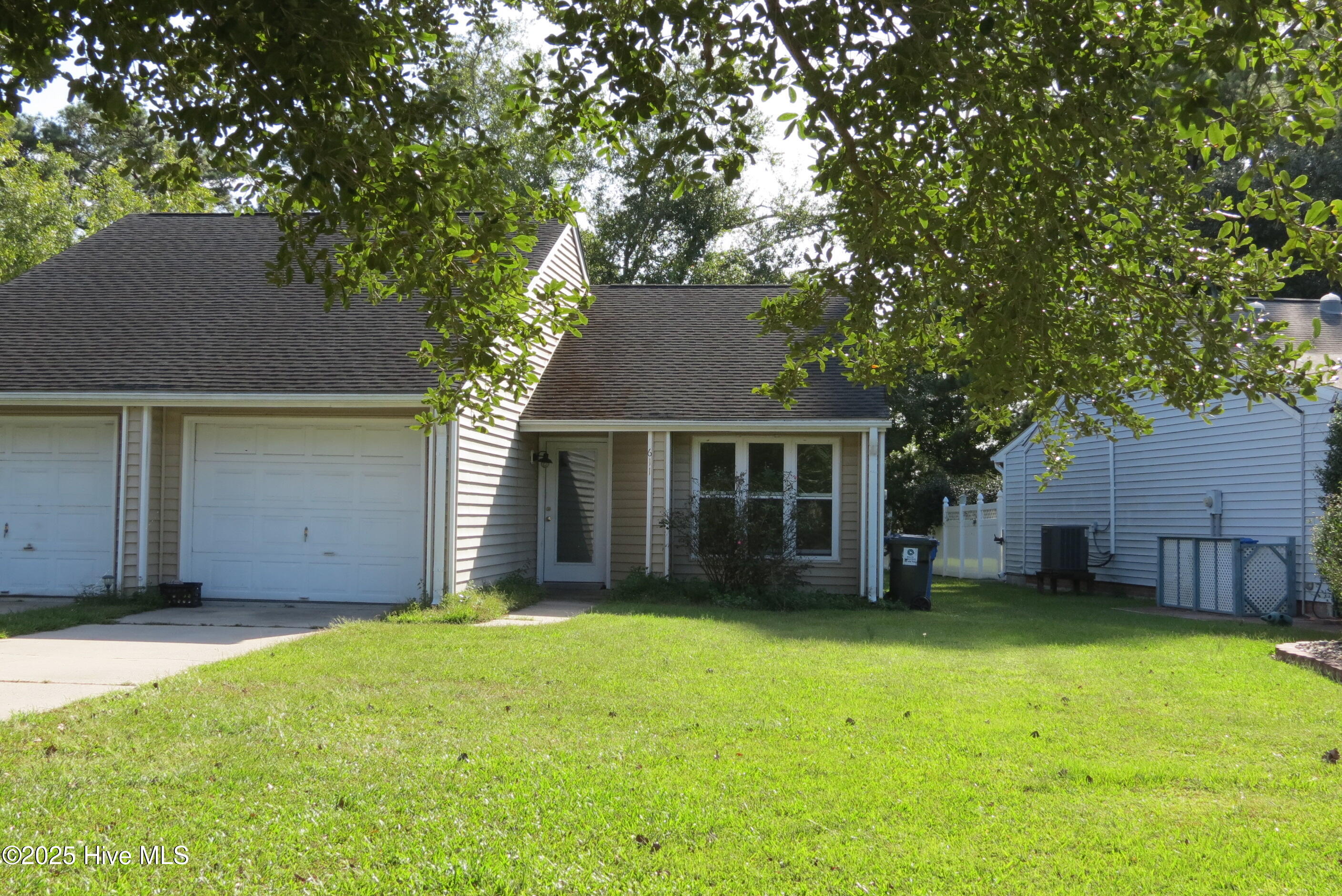 A LOW-MAINTENANCE  1/2 DUPLEX RESIDENCE IN DOWNTOWN ORIENTAL! Here's the rarest of rare opportunities... A chance to own an affordable, comfortable residence on desirable Ragan Road, within walking distance to everything our charming town has to offer! A single level unit, consisting of two bedrooms, two baths and a one car garage on approximately .19 acres! This property is a proven winner, a perfect rental investment, 2nd home, primary residence and is a low-maintenance dream. The home shares a party wall with its neighboring unit (also available in combination with this property) but is designed to convey the sense of separation and is set back from the road. If ever you wanted an affordable home in Oriental, with an attached garage, this would be it!! You enter a small foyer which quickly draws you into the large (15'4'' x 22'2'') vaulted great room with a fireplace/hearth straight ahead and an efficient galley kitchen to the side, open to the living area. Off a side corridor you'll find the bedrooms, with the master bedroom facing the backyard and enjoying an ensuite bath! The front facing guest bedroom is cozy & would make a great office/media room too! The backyard is reached from the living room and features a small private patio (perfect for grilling) and a lengthy back yard for kids, pets and gardening! There's a beautiful mature oak behind the unit, offering a delightful shade and elegance. This unit owns the property on which it is built and you'll love the location, the layout and the possibilities of this well... Here's your opportunity to have a unique life in Oriental- close to everything and yet quietly tucked away from noise and traffic! Take a look soon... The property is your dream that's priced to sell!! It checks all the boxes with its location & floor plan and is OUT OF THE FLOOD ZONE! If you are interested in purchasing the entire 2-unit building, please inquire for details. You could live in one side and rent out the other!