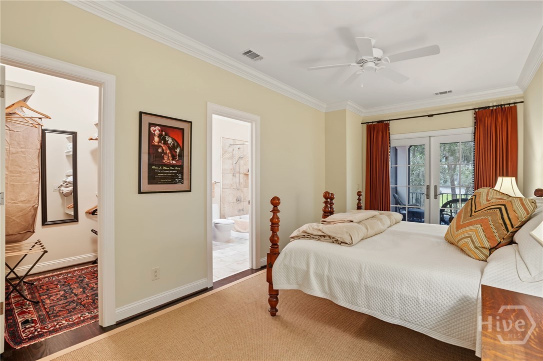 Guest Bedroom 1 with ensuite bathroom and access to screened porch