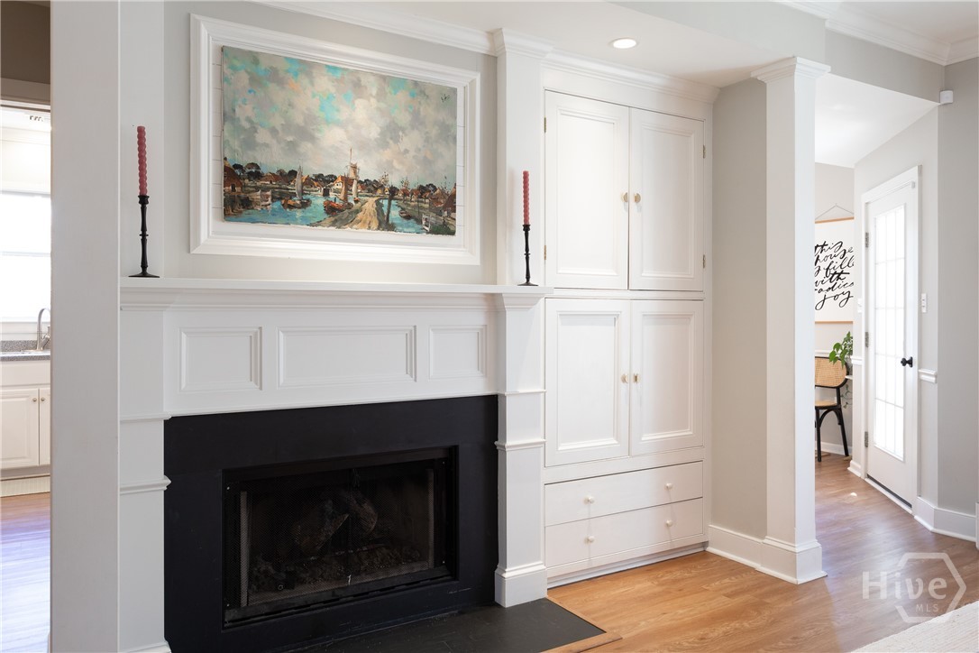 Gas fireplace w/ built in cabinets for storage
