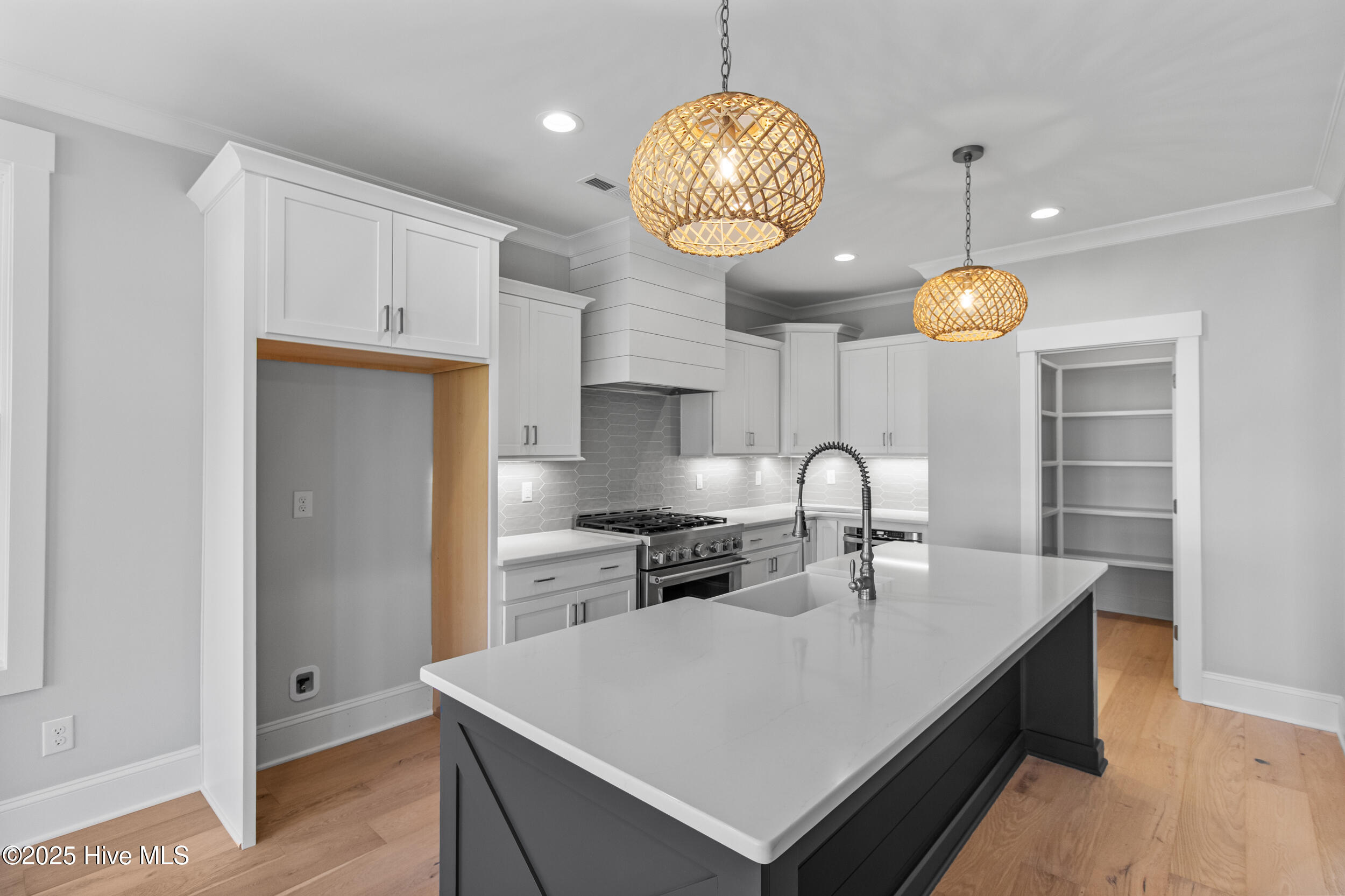 Spacious kitchen with island, sink, and seating