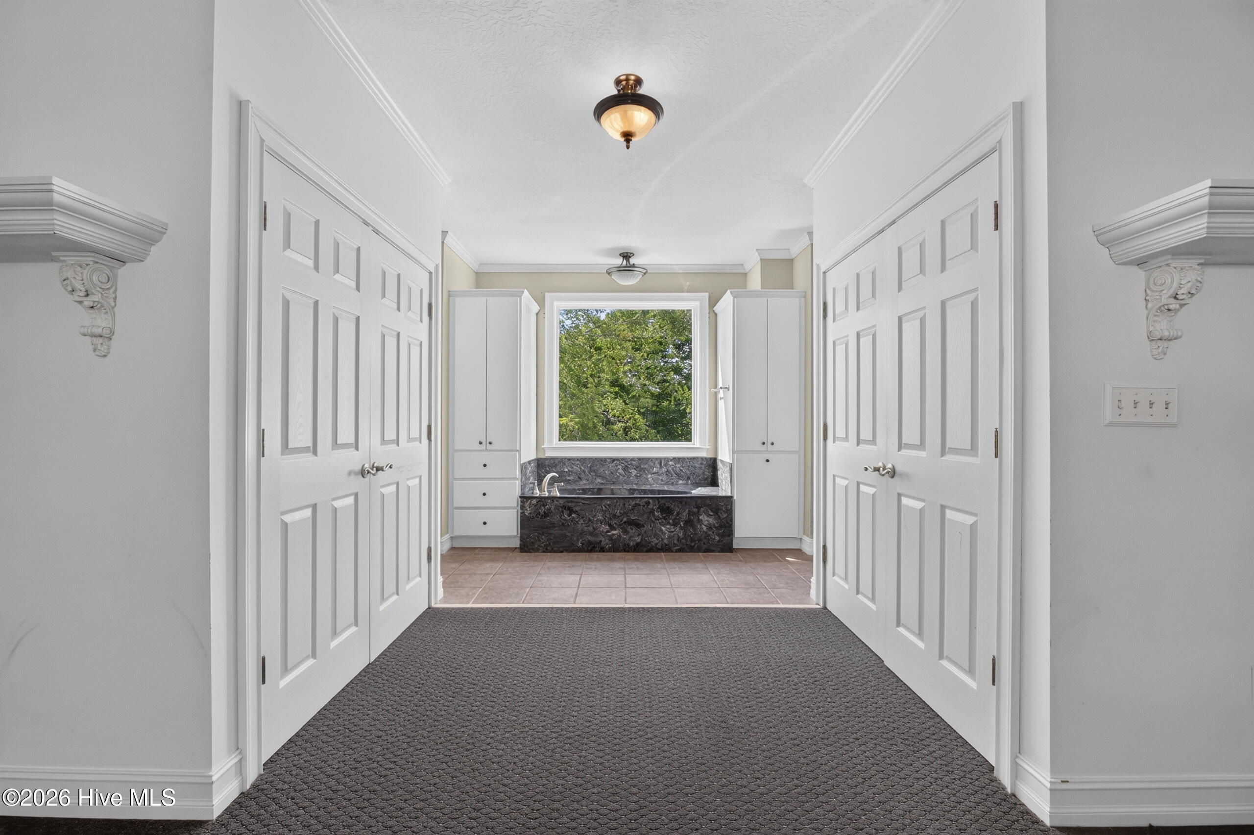 Owner's Suite - 2 closets, 2 sinks, soaking tub + shower