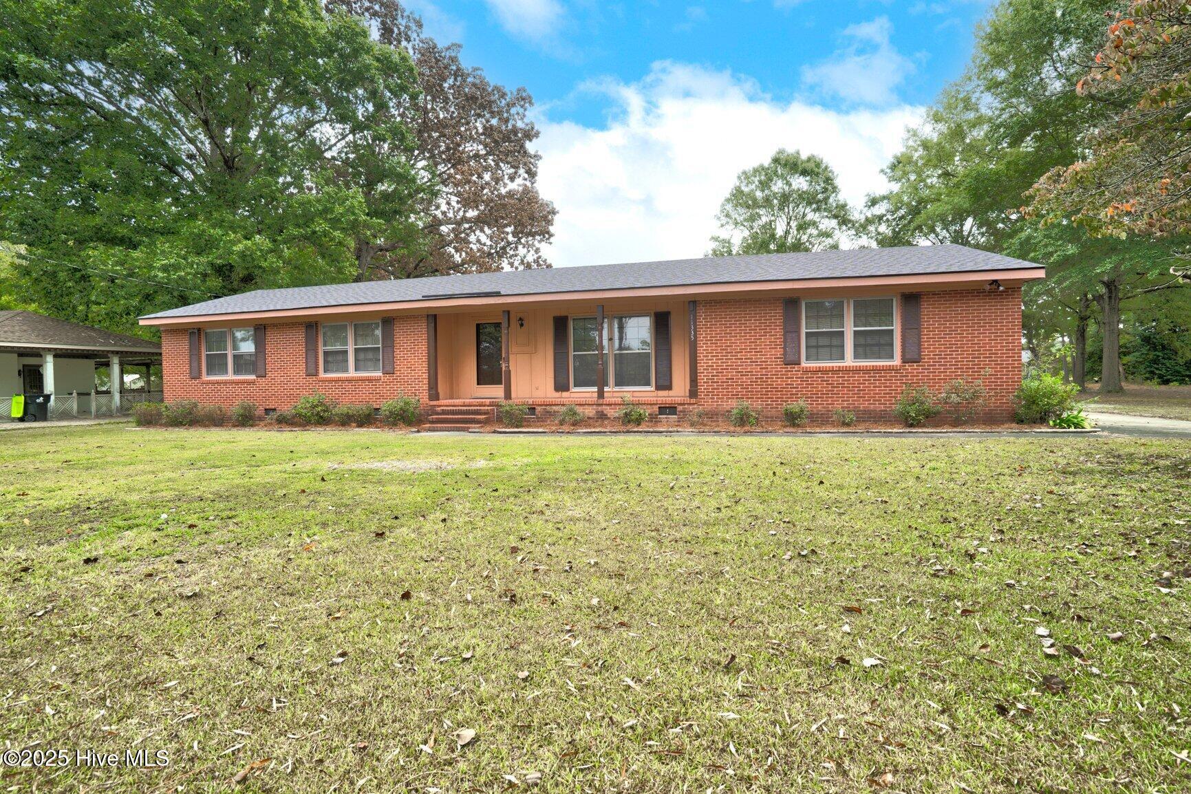 Spacious 3-Bedroom, 2-Bath Brick Ranch on a 1.07-Acre Corner Lot! Enjoy country living with room to roam while still being just a short drive from the Tar River Reservoir for boating, fishing, and recreation. This home features a new roof in 2024 and classic brick construction for easy maintenance. With plenty of outdoor space, a large yard, and a convenient location, it's the perfect spot to relax, entertain, and enjoy life in Rocky Mount. Move-in ready and full of potential-don't miss this one!