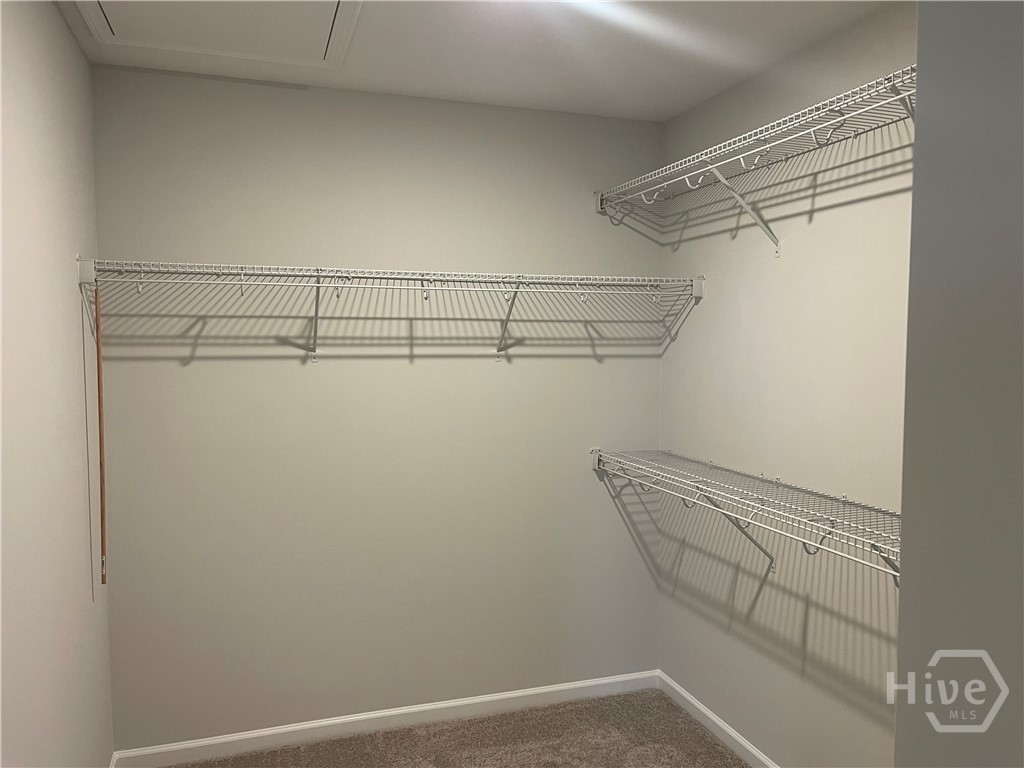 One of Two Primary Walk In Closets