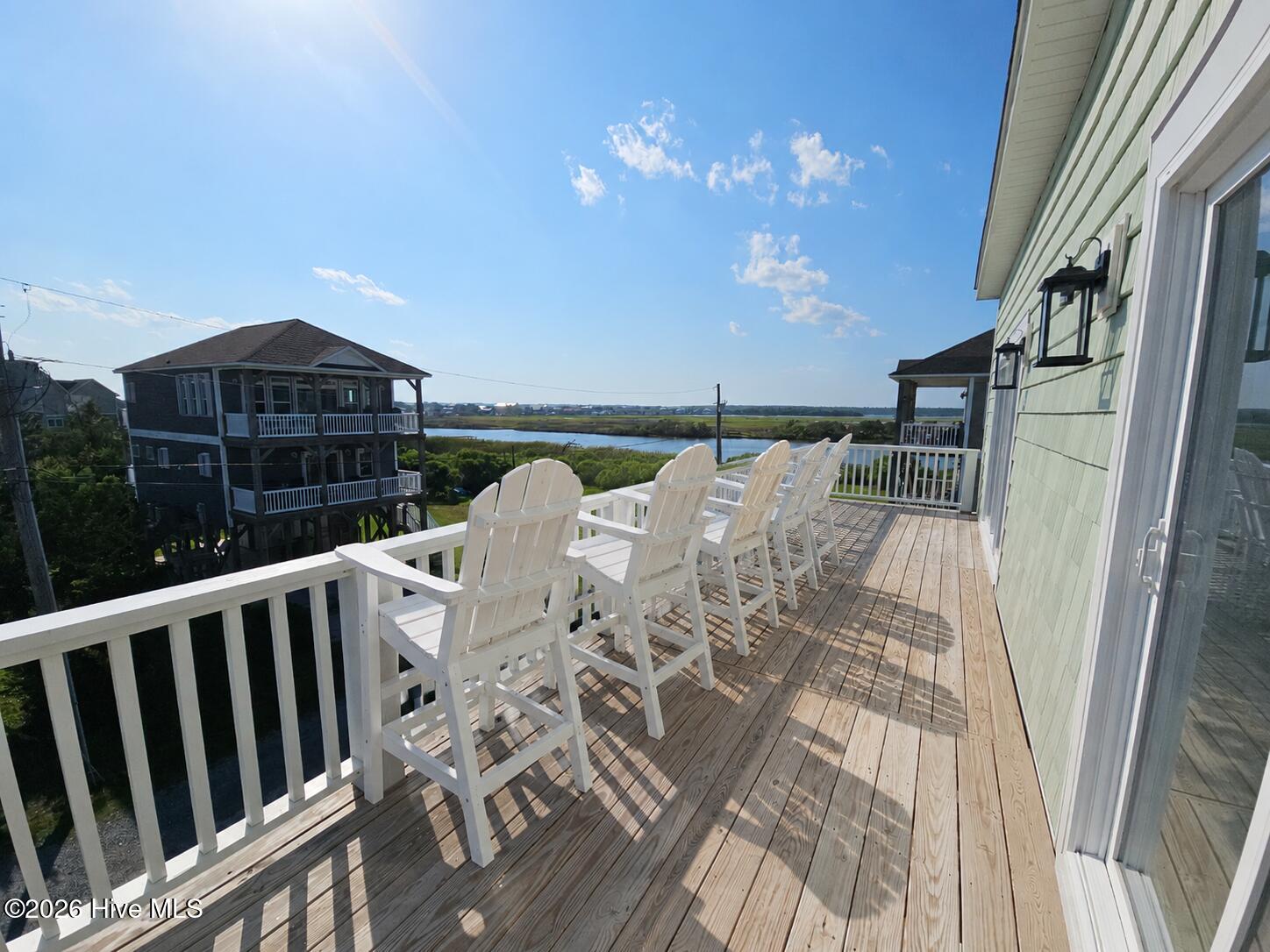 Virtually staged photo of second floor front porch