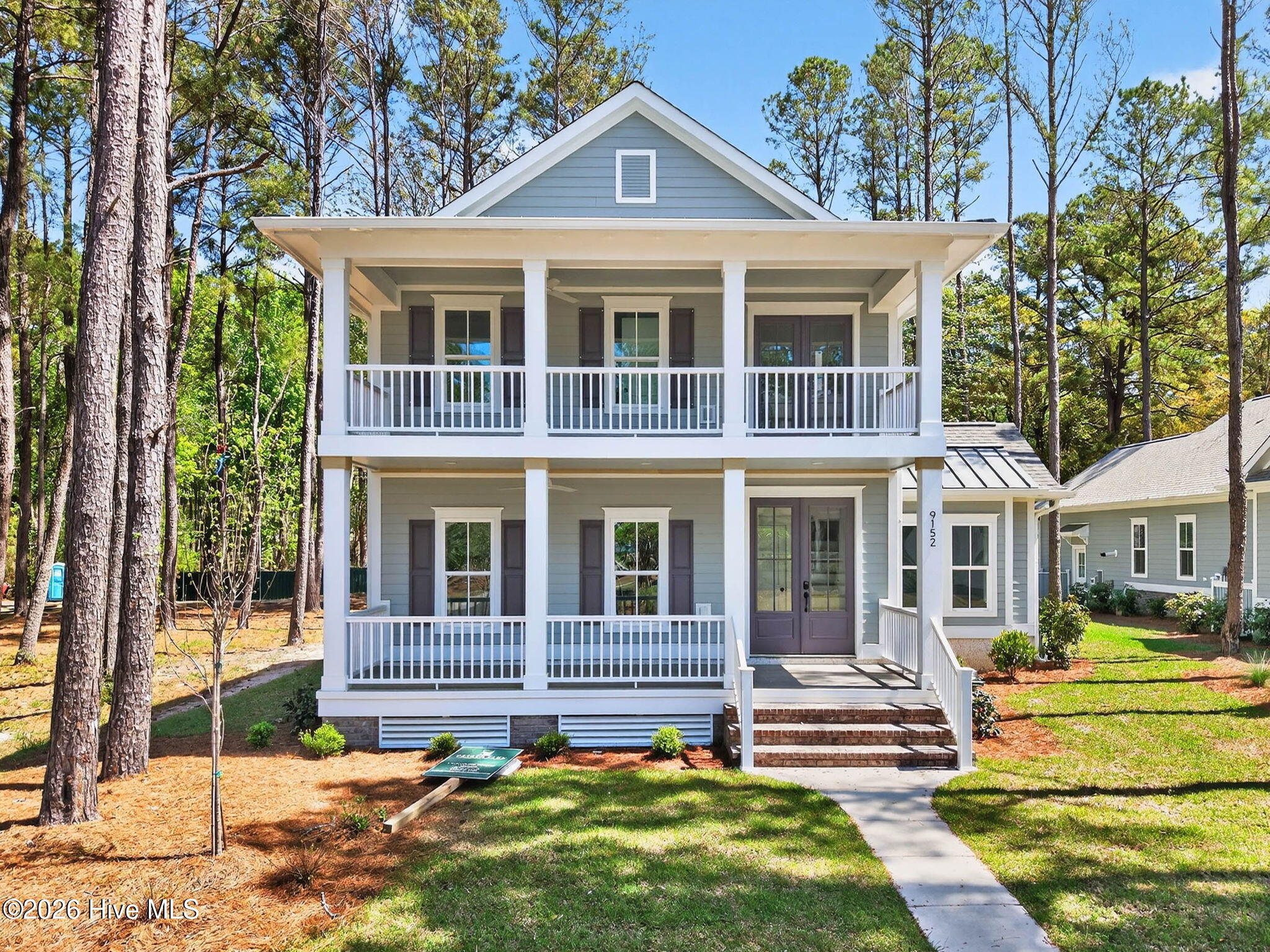 Welcome to ''The Sweetbriar'' , a thoughtfully designed Lowcountry retreat nestled in the heart of the sought-after Devaun Park community.This inviting double front porches, classic brick steps, and elegant tongue & groove ceilings. Inside you will find a 4-bedroom, 3-bathroom home that blends Southern charm with modern living, perfect for retirees, families, or vacation home buyers looking to enjoy coastal Carolina life. Step inside to discover a bright and airy open-concept living space, complete with a gourmet kitchen featuring custom cabinetry, stainless steel appliances, and an oversized island — perfect for entertaining. The primary suite on the main level is a private sanctuary, offering his-and-hers walk-in closets and a spa-like bath featuring an oversized walk-in shower. A second bedroom on the first floor offers flexibility as a home office, guest suite, or cozy den. Upstairs, two additional bedrooms and a full bath create comfortable guest or family space. This home also features not one but TWO outstanding porches perfect for relaxing in the warm coastal breeze!Another standout features of this home is its alley-load garage, preserving the charm of the front streetscape while adding convenient rear access — a hallmark of the classic Devaun Park design, known for its pedestrian-friendly layout, tree-lined sidewalks, and welcoming front porches.Located just minutes from Sunset Beach, this coastal gem also offers easy access to world-class golf courses like Rivers Edge, Oyster Bay, and Sea Trail Golf Club. Plus, the nearby village of Calabash offers famous seafood dining, shopping, and waterfront charm.Whether you're seeking a primary residence, a vacation retreat, or a low-maintenance retirement home, this beautifully designed home delivers both style and function in one of the area's most desirable neighborhoods.Under Construction and ready to claim it as your new home.