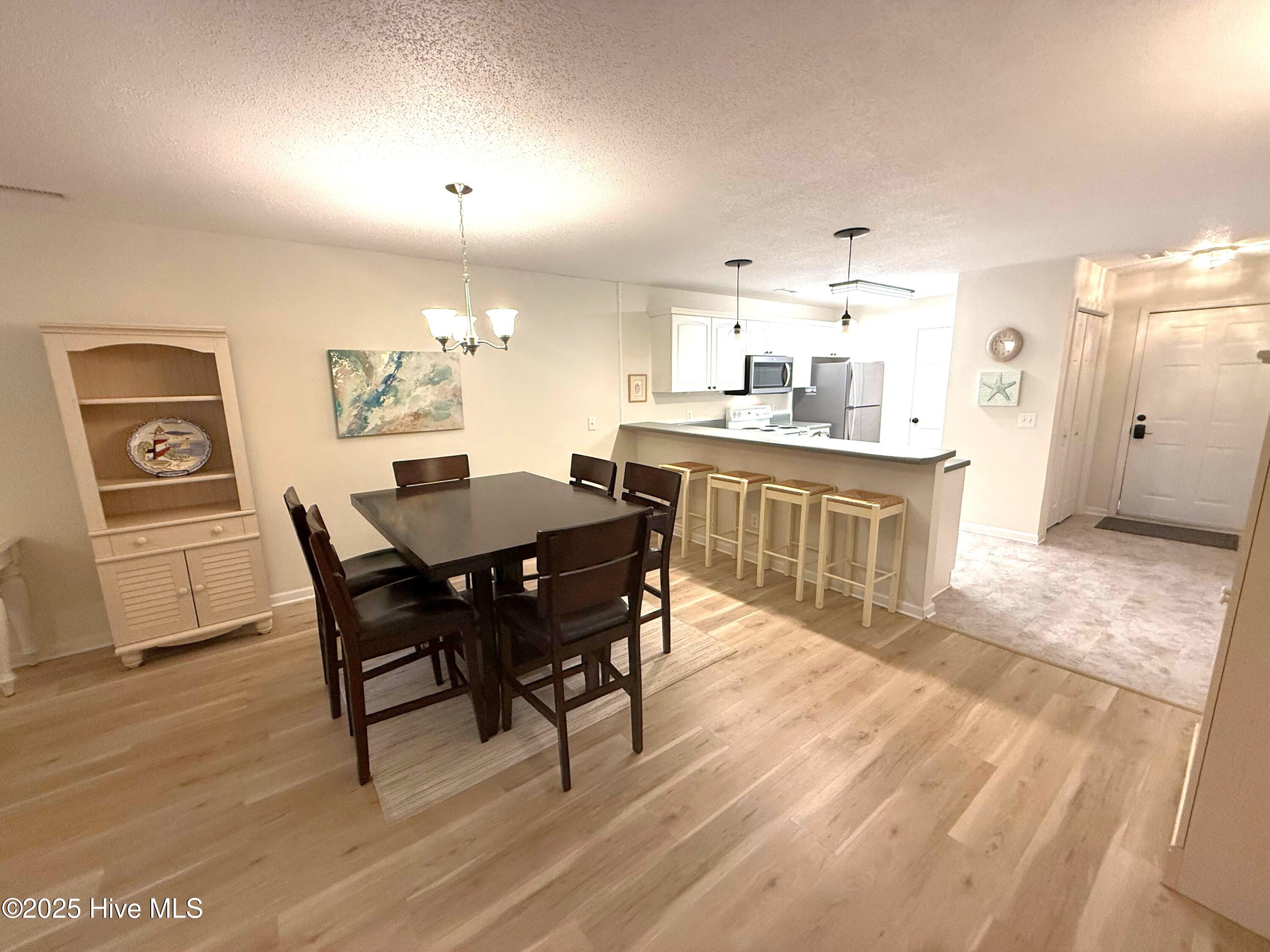1620 Goley Hewett Road SE Unit 307, Bolivia, NC 28422 – photo 6: Entry Kitchen Dining 2