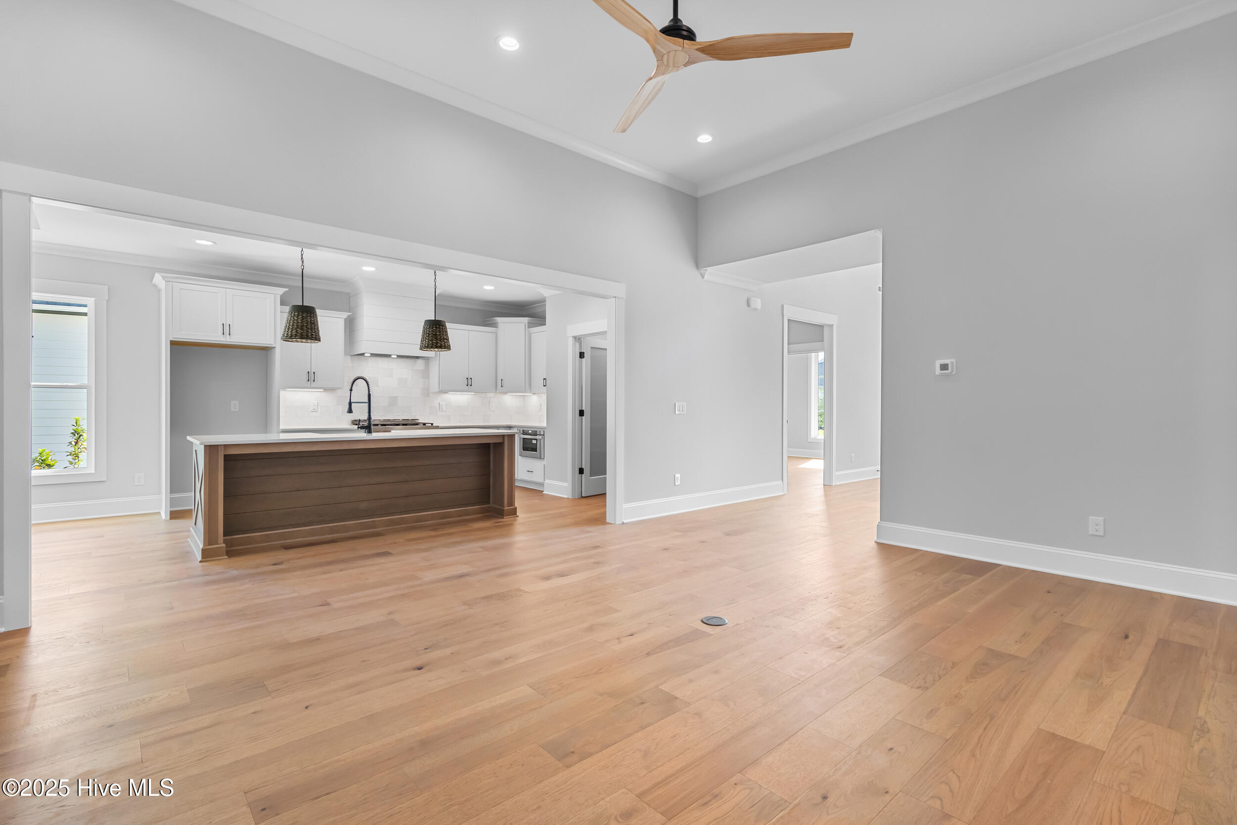 Open living room space leading to kitchen