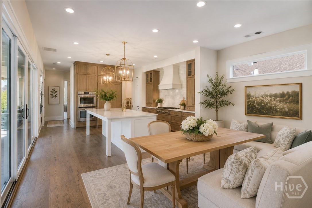 Chef's kitchen and view to family room - Image is virtually staged and AI generated.