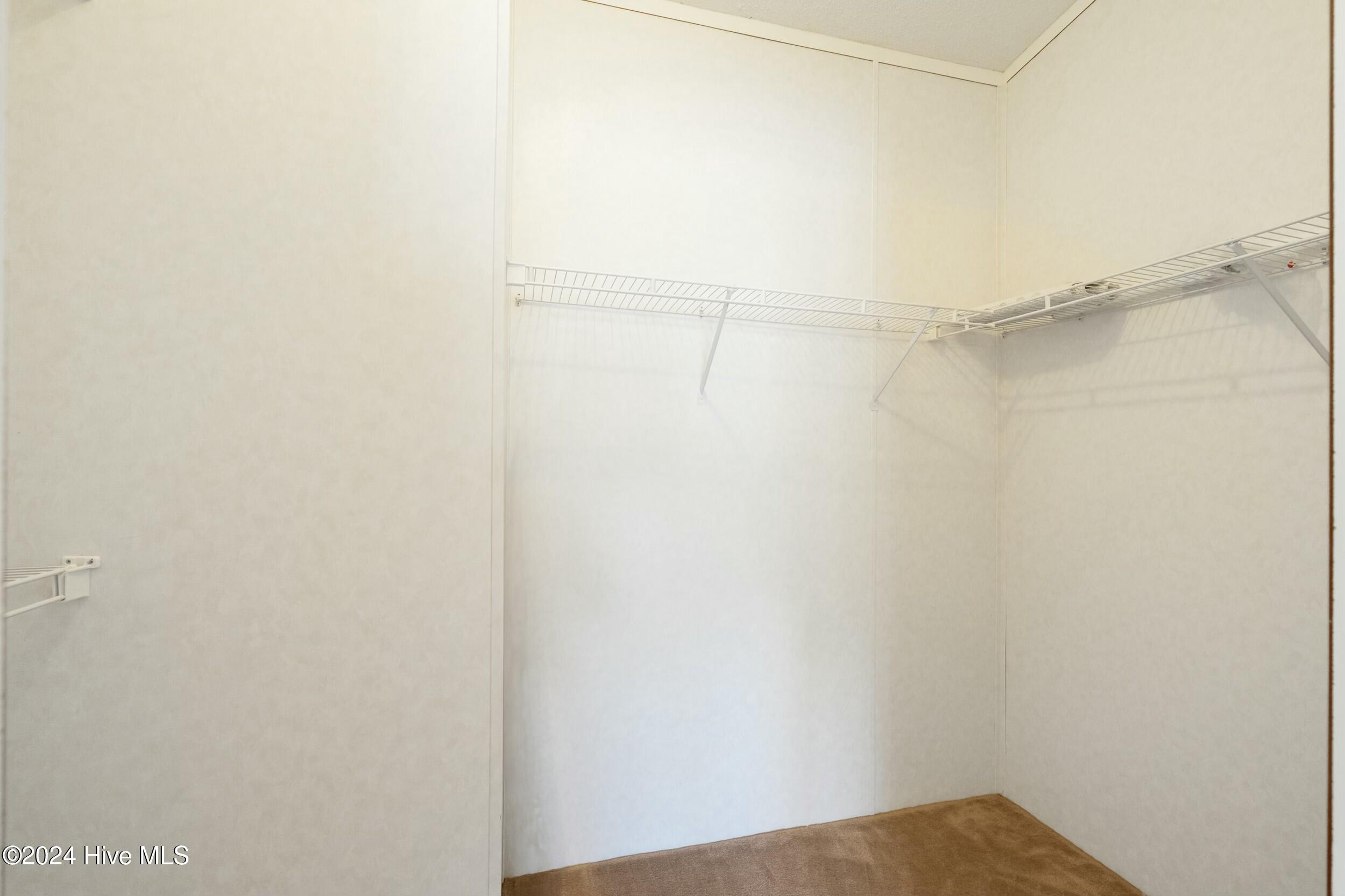 1104 Captains Court, Carolina Shores, NC 28467 – photo 20: Owner's Walk-In Closet
