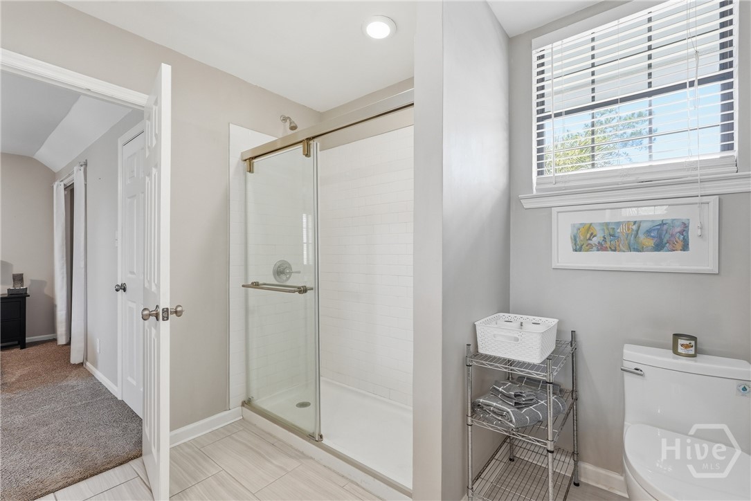 Jack & Jill bathroom also includes walk-in shower and tile floors