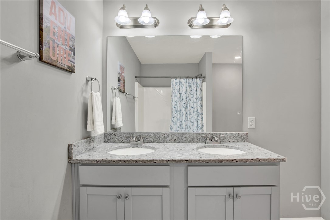 Upstairs Hall Bathroom with Double Vanity and Tub/Shower Combo