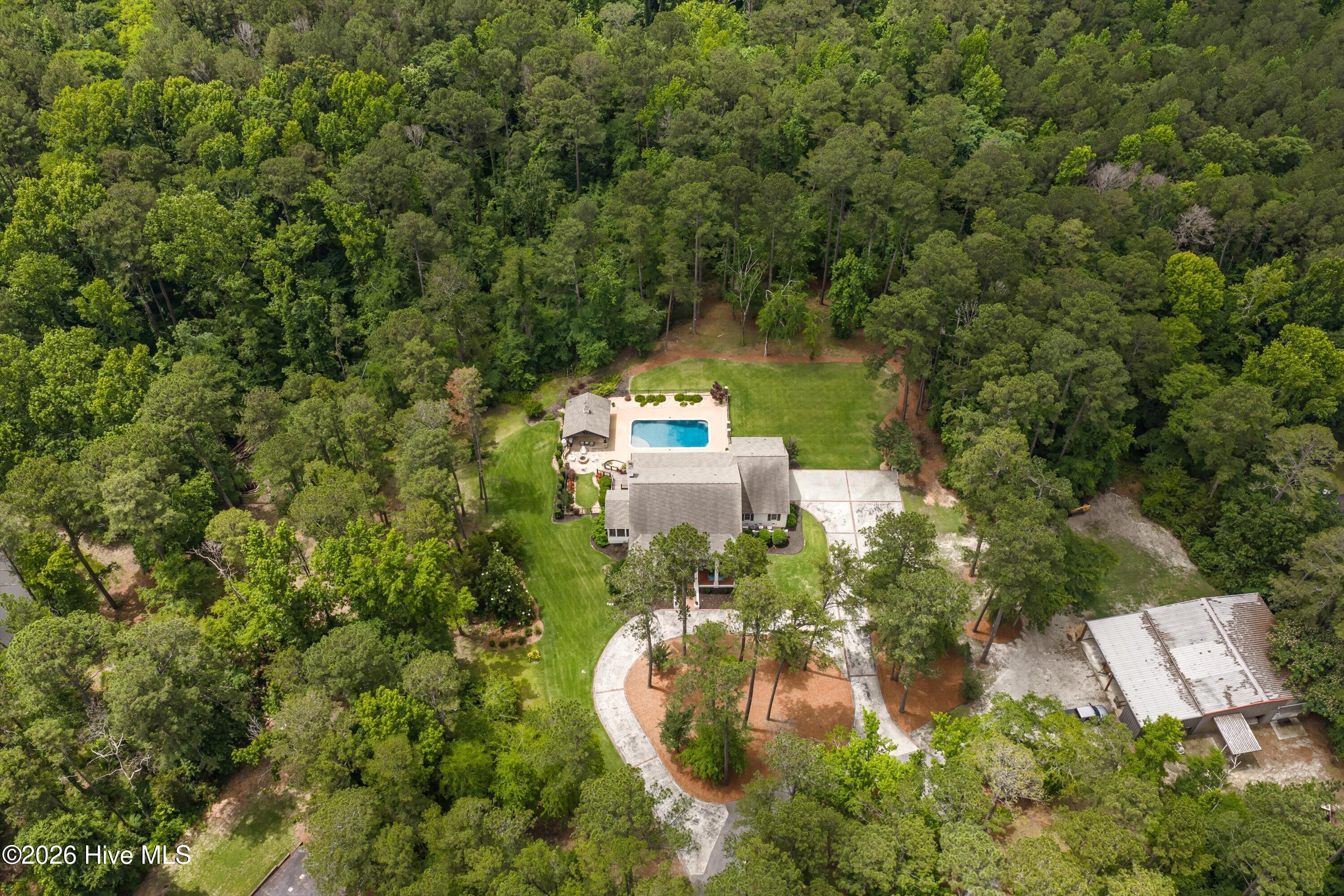 There is a shared pond to the left of the pool just into the tree line