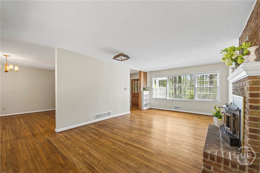 Living Room to Dining Room & Front Door View