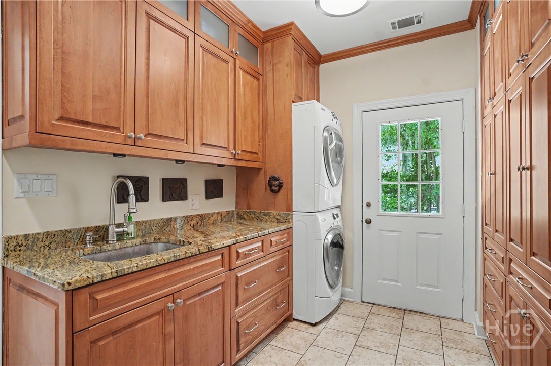 Laundry with sink and plenty of storage