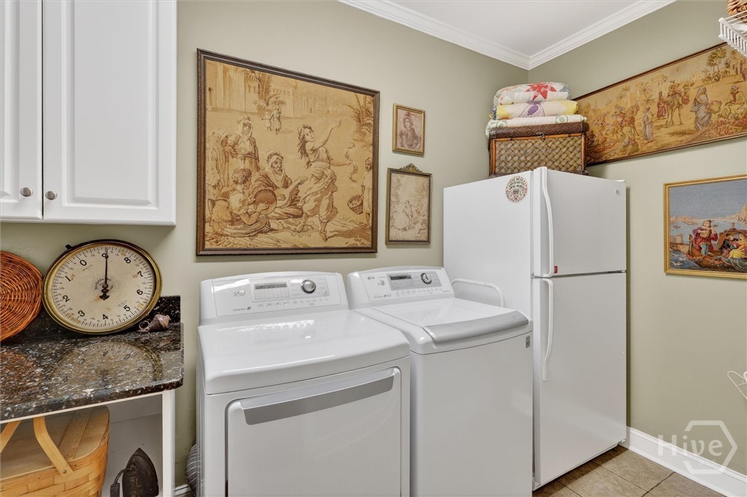 Large laundry room with storage