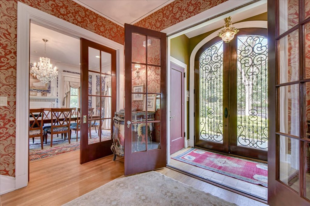 Tiled floor vestibule with double coat closets
