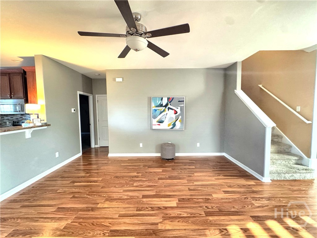 Living Room Showing Stairs to Second Floor and Master Bedroom Entrance