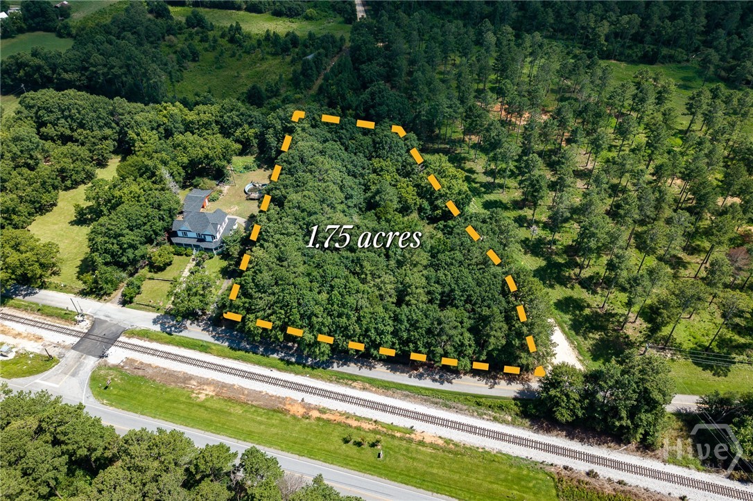 Welcome to this beautiful 1.75 acre wooded tract on the corner of Railroad Avenue and West Street so close to both Watson Mill Bridge State Park Equestrian facility and trails (1 mile!) as well as downtown Carlton! Come build your dream home on this level and wooded lot. Easy access to water and power at the street. Just 20 minutes to either the large groceries and shopping areas in Hull and Elberton, this location provides the peace of the countryside and the convenience of local amenities.