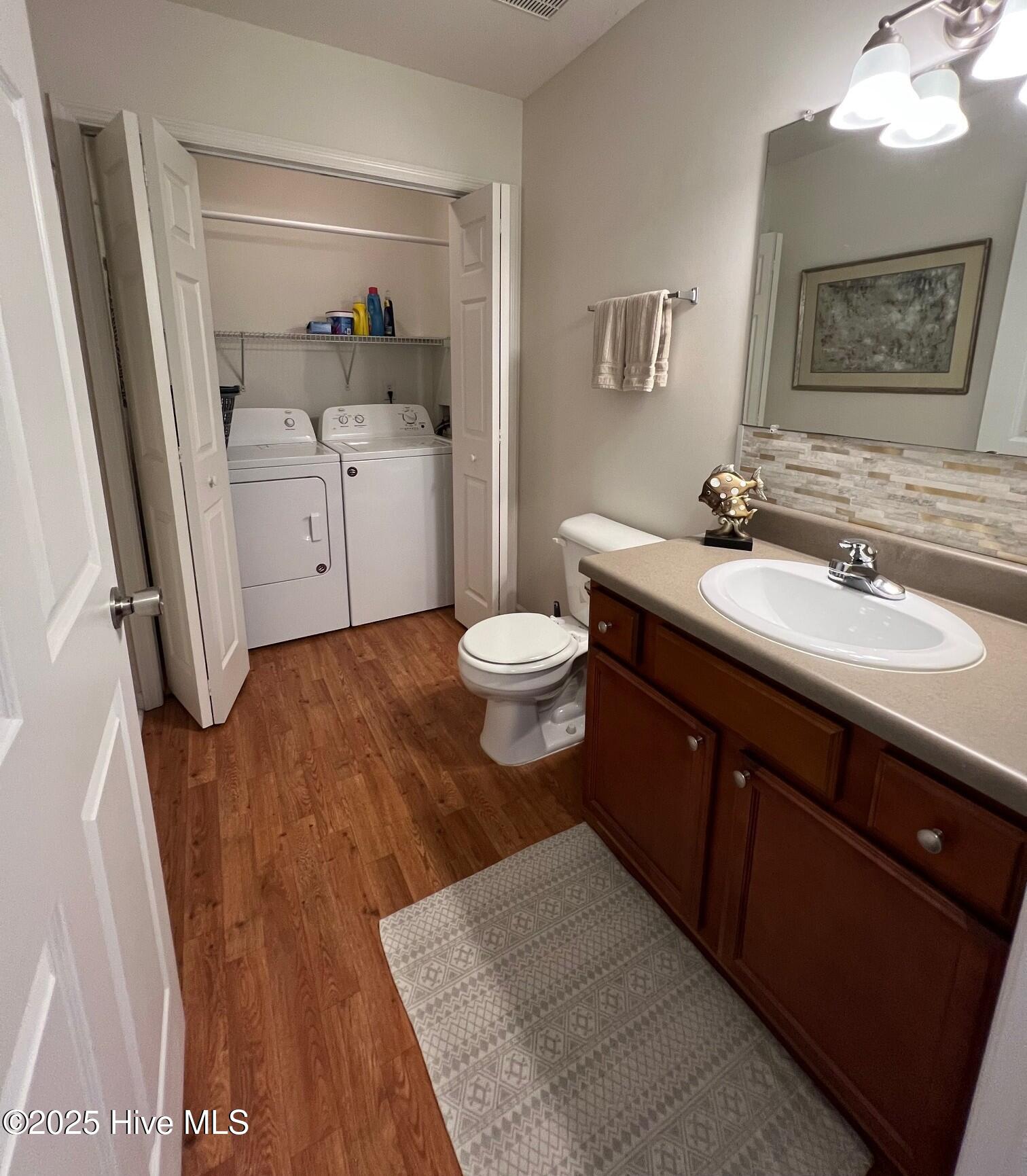 137 Jessie Circle, Hubert, NC 28539 – photo 24: 22 Laundry room and half bathroom on