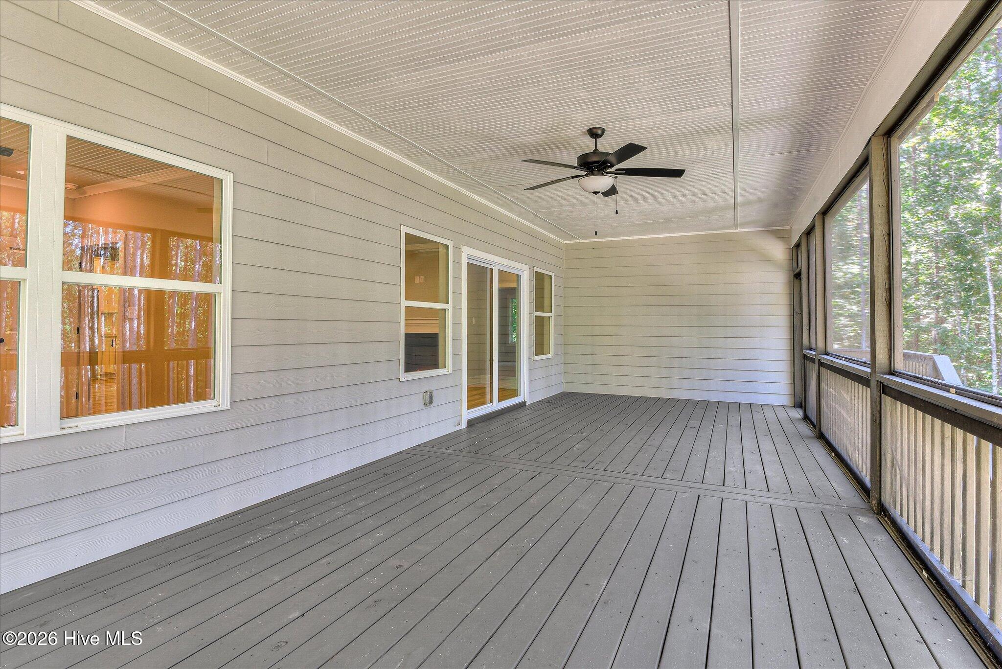 Screened porch stretches across the back of the home.