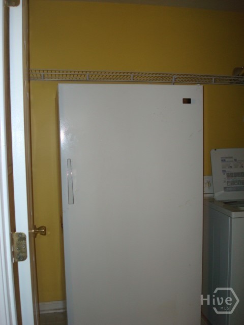 Laundry room has room for a freezer, washer and dryer (not included).