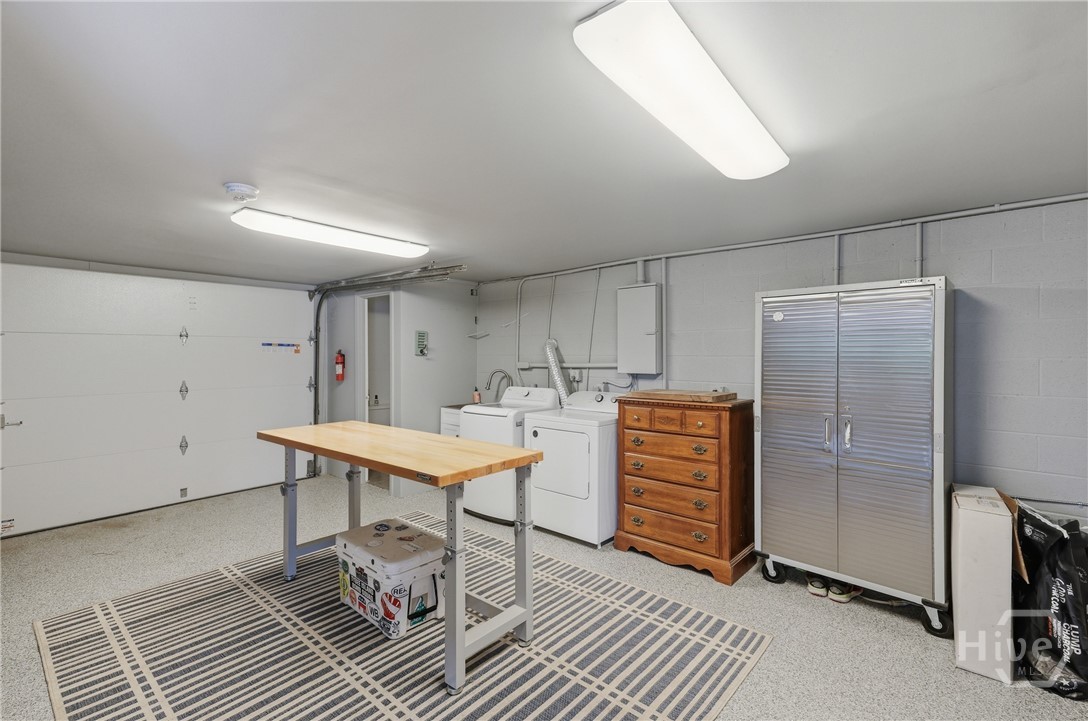 Separate garage area with workshop and half bath