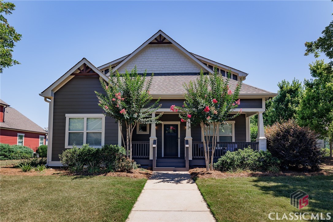 Welcome to your charming home in the desirable Cobblestone community of North Oconee! This inviting 5-bedroom, 3.5-bathroom home offers a comfortable blend of style and practicality, perfect for modern living. Conveniently located on the main level, the primary suite features a spacious layout, an additional sitting area, a walk-in closet, and an en-suite bathroom. The open concept living and kitchen area is perfect for gatherings, with ample natural light and a seamless flow. The kitchen includes granite countertops and a large counter for extra seating. Host family dinners in the separate dining room at the front of the home.Upstairs, you'll find four generously sized bedrooms and two full bathrooms. Each room is filled with natural light and has ample closet space. Enjoy your morning coffee on the charming front porch or unwind in the evenings on the side porch, both offering peaceful outdoor retreats. Take advantage of the community amenities, including a pool and tennis courts, perfect for staying active and socializing with neighbors. All NEW exterior paint!