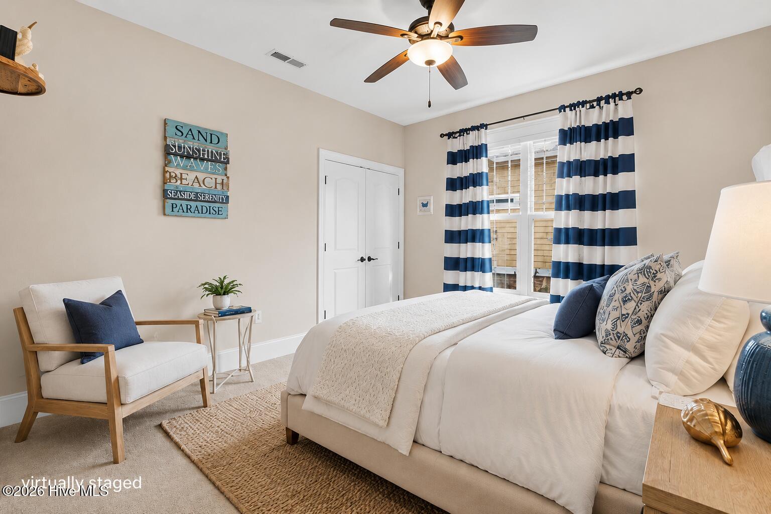guest bedroom on primary level- virtually staged