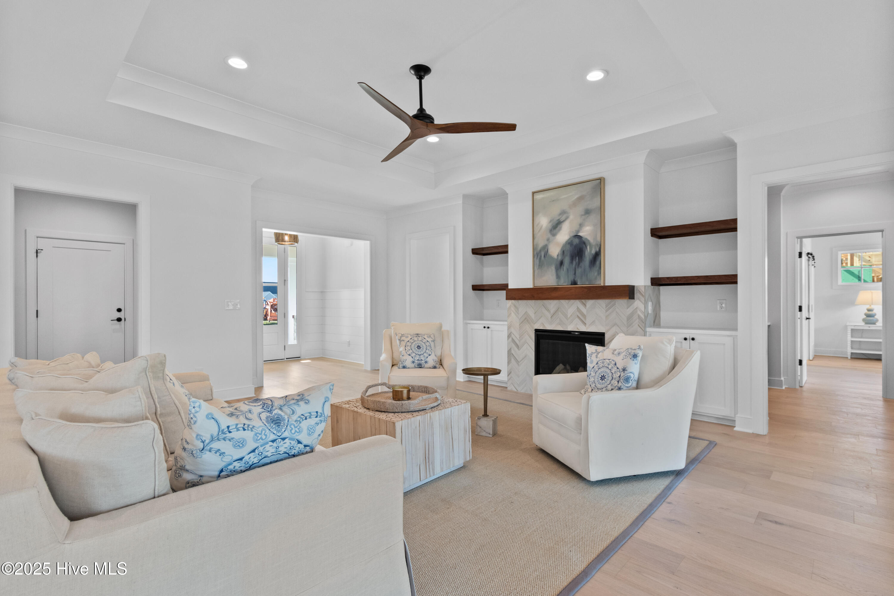 Living room with electric fire place and built-ins