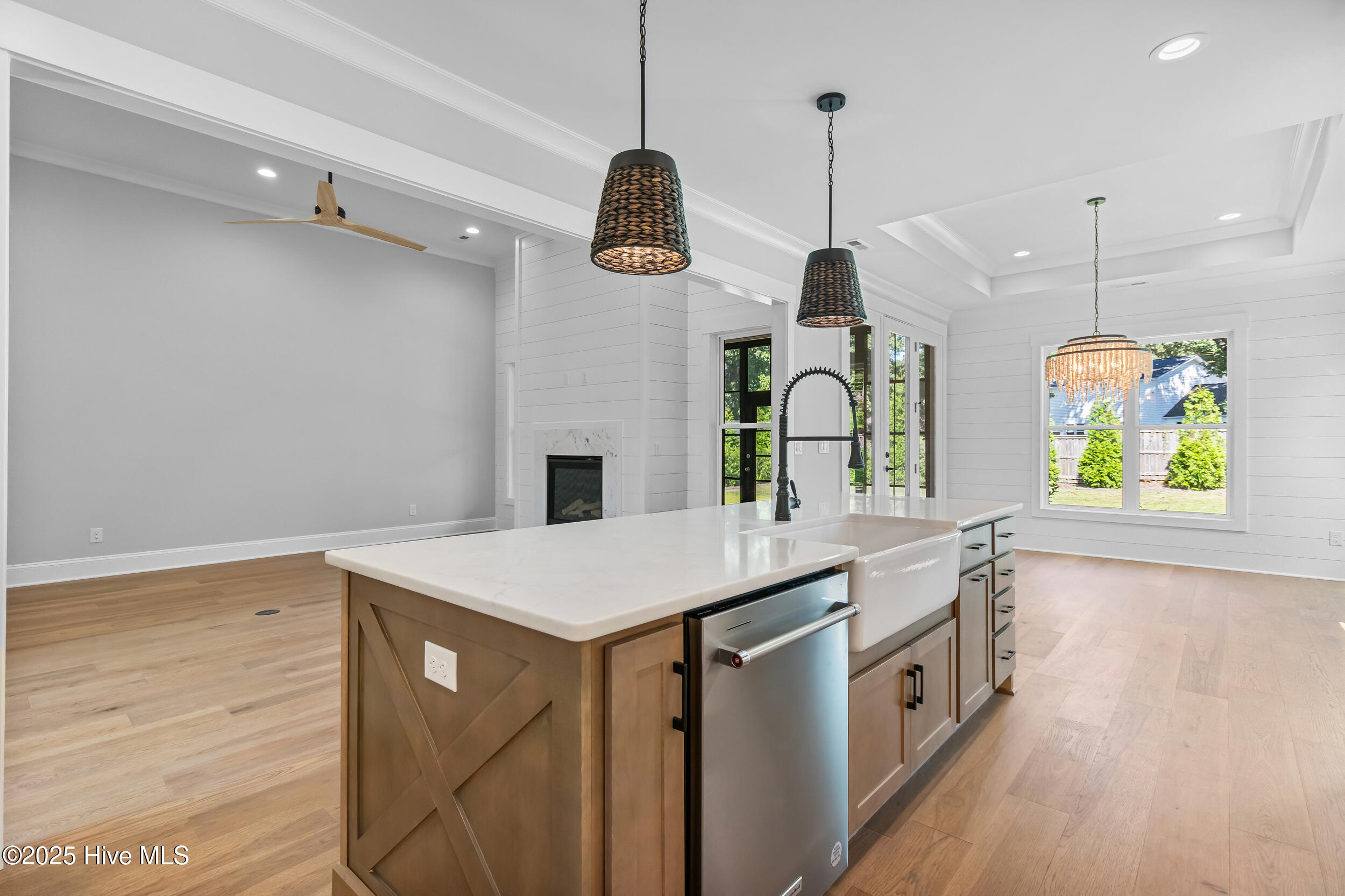 Kitchen opening to living and dining area