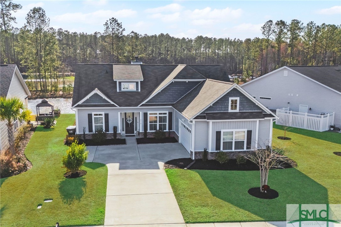 This home impresses at every turn. With meticulously maintained landscaping and a pristine exterior, it stands out as a true gem. The screened porch leads to a custom paver patio with a pergola, offering stunning lagoon views in a fully fenced backyard. Inside, no detail has been overlooked featuring a wood-burning fireplace, granite countertops, soft-close cabinets, tray ceilings, crown molding, cottage-style trim, and cased windows. A spacious loft with a full bathroom completes this exceptional home!