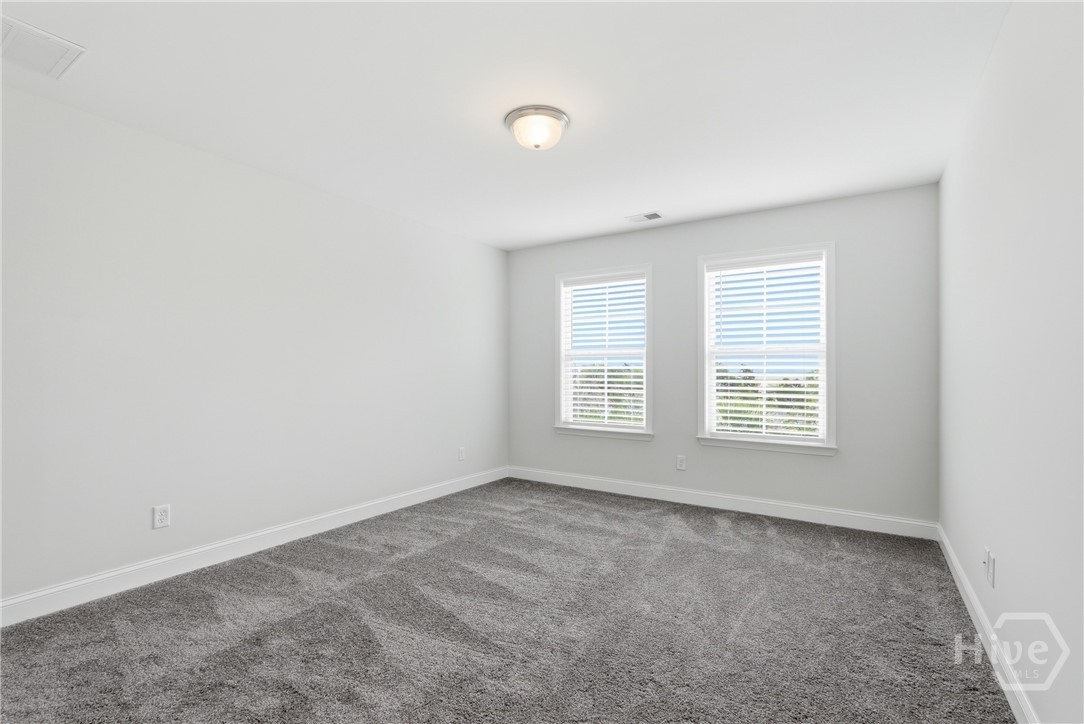 3rd bedroom with walk-in closet + walk-in attic