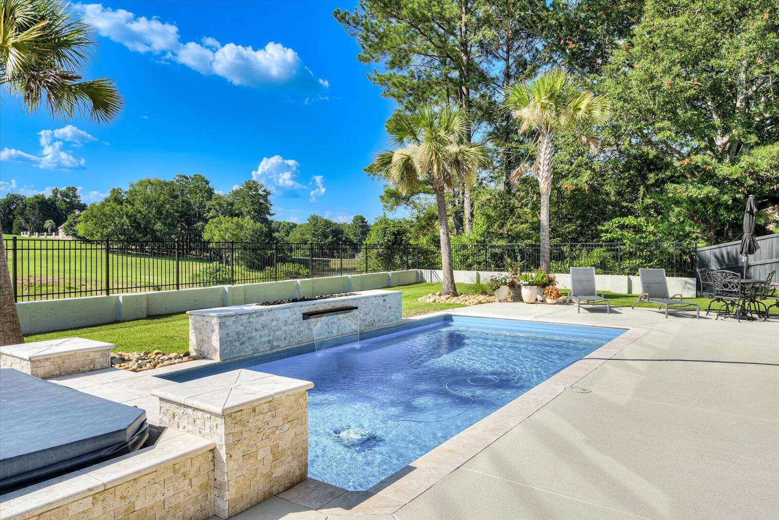 Pool/Spa- Fiberglass pool by Thursday Pools; “Lil Bob” 13.5 x 27.5; 4 ft to 6 ft deep. Water feature wall w/48’ waterfall and gas fire feature. Pentair salt generator. SuperFlo pump:variable speed.Dual timers. Handheld remote.Cartridge filter.