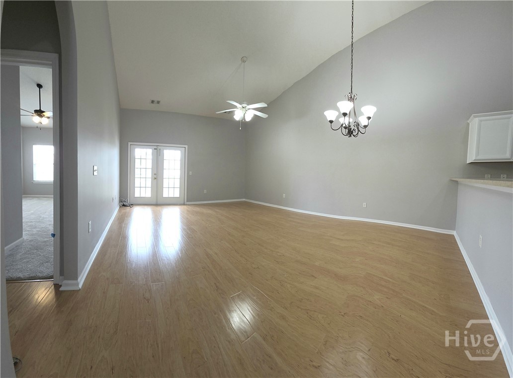 Great Room has hardwood floors and gives access to Master Bedroom and Back Porch & Patio.
