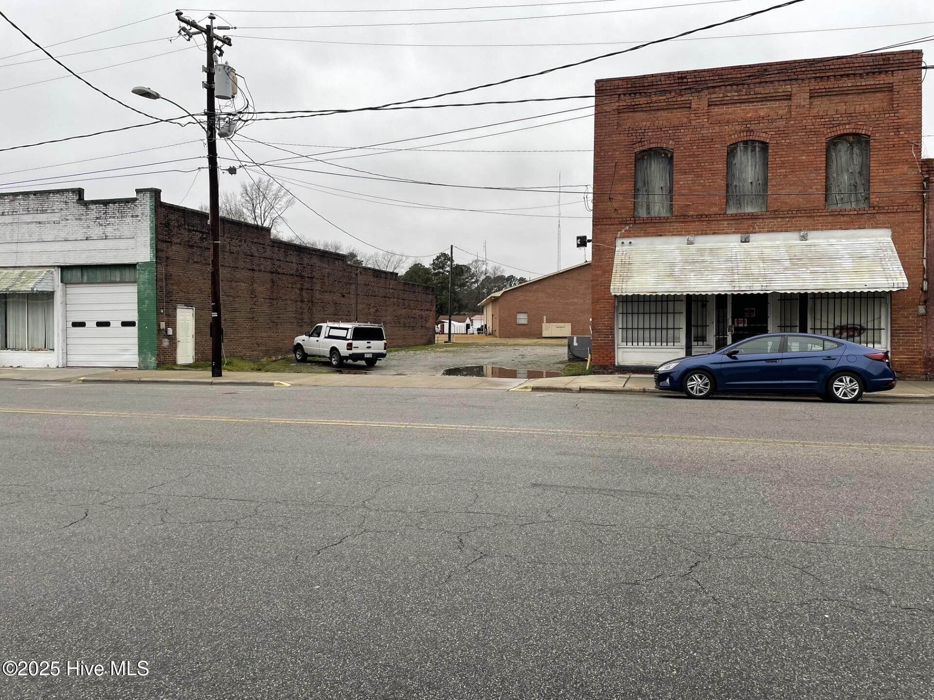 Bring all Offers, Motivated Seller! Are you ready to start your business venture?  This two story brick building, selling as-is and needs work but can be the answer to your business needs. Located in the general business district, it has huge potentials and is ready for you.  Whether it's a restaurant, teaching self defense, opening a badly needed full service grocery store, retail fashion or all of the above; this building with street and off street parking can accommodate your dreams.  You can use the downstairs for your business and renovate the upstairs for studio apartments, giving multiple sources of income.  Call me today to schedule your private showing.  Gaming internet cafe equipment does not convey with building but is available to purchase separately.