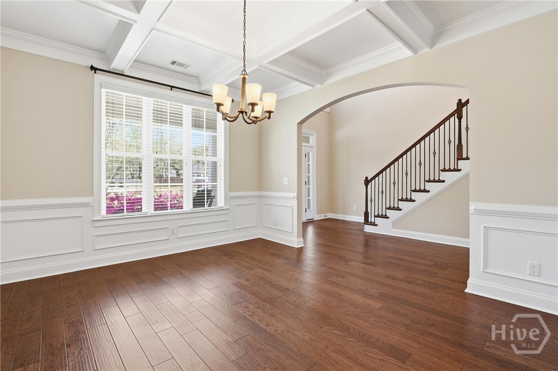 Formal Dining with Coffered Ceiling and Accents Not Staged