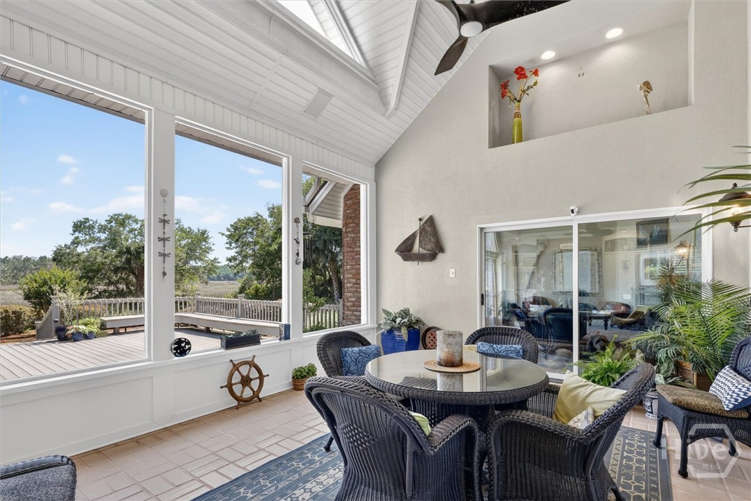 Screened patio with vaulted ceiling and marsh view