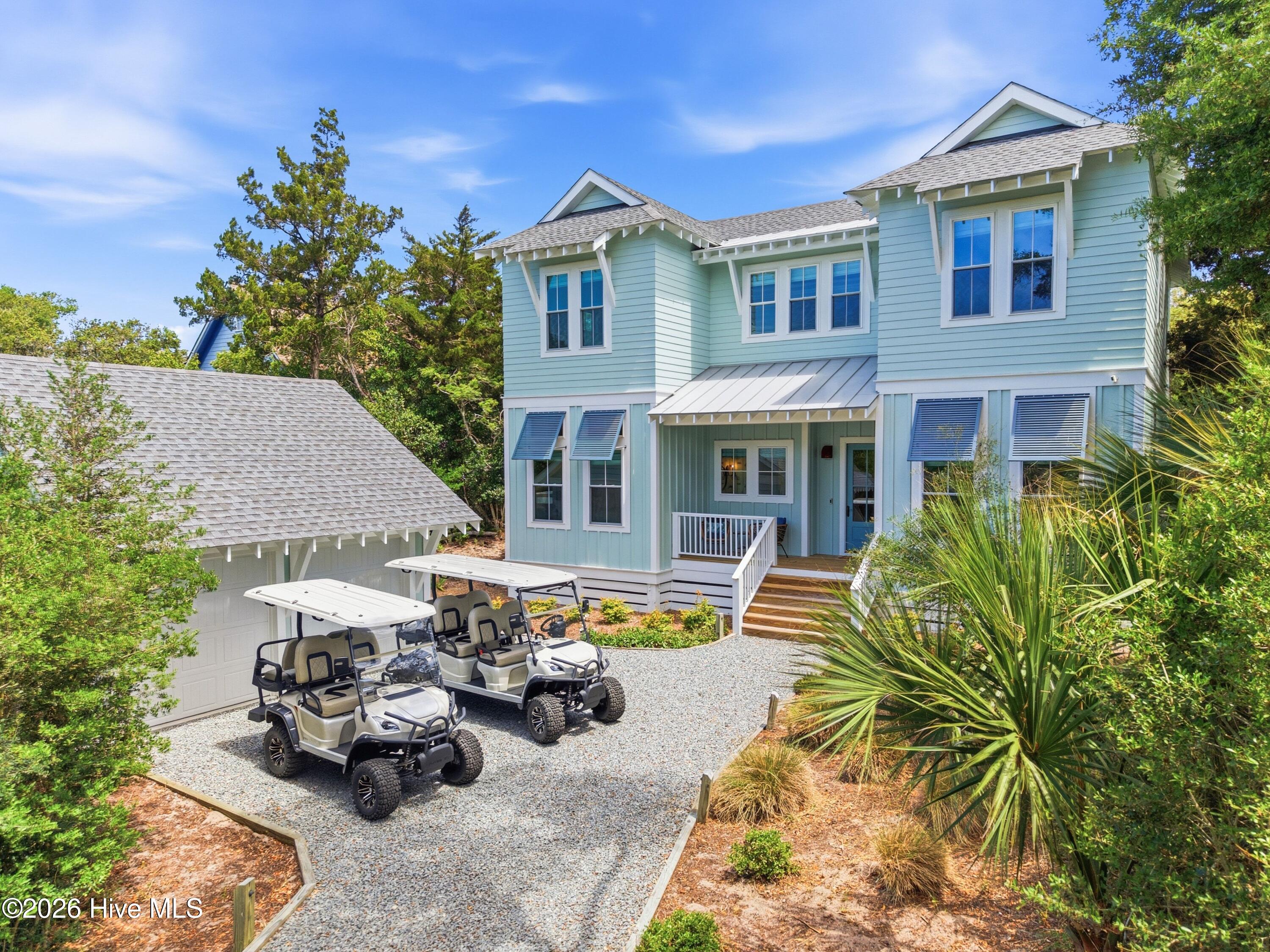 Home conveys with 2 golf carts.
