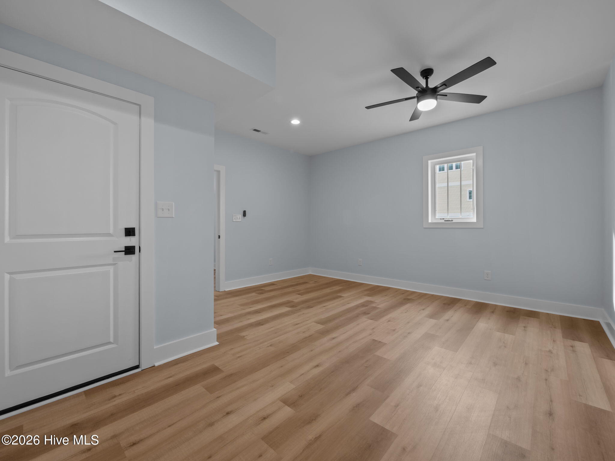 Main level bonus room with entry to garage.