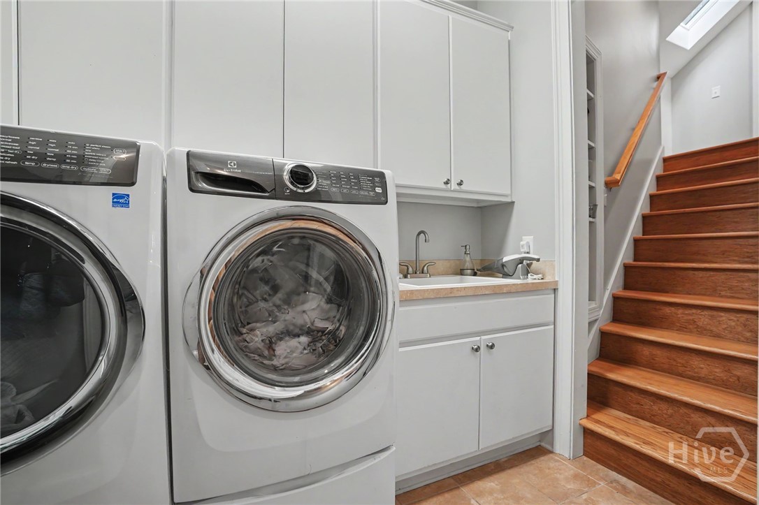 Laundry Room behind the kitchen and at the base of the Bonus room steps