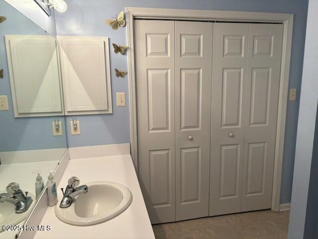 Laundry closet in hall bath