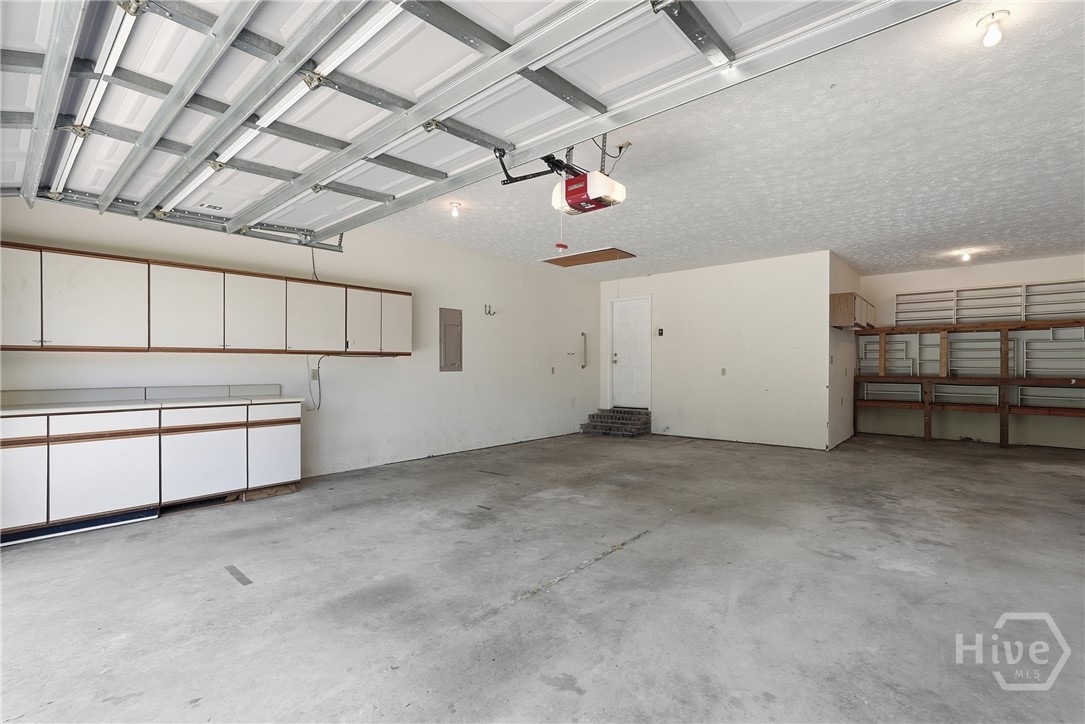 This oversized garage can hold 2 vehicles plus a small boat, golf cart, or ATV.