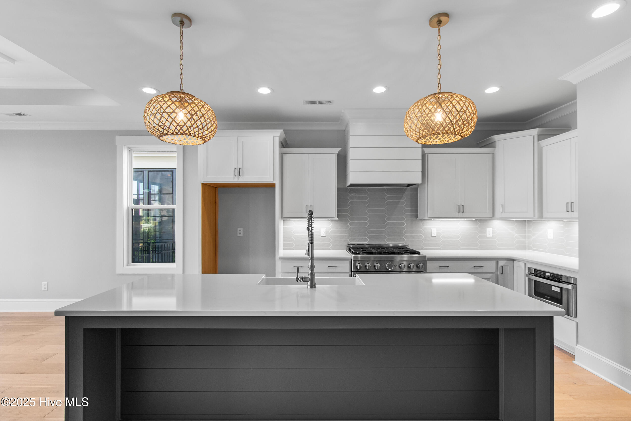 Spacious kitchen with island, sink, and seating