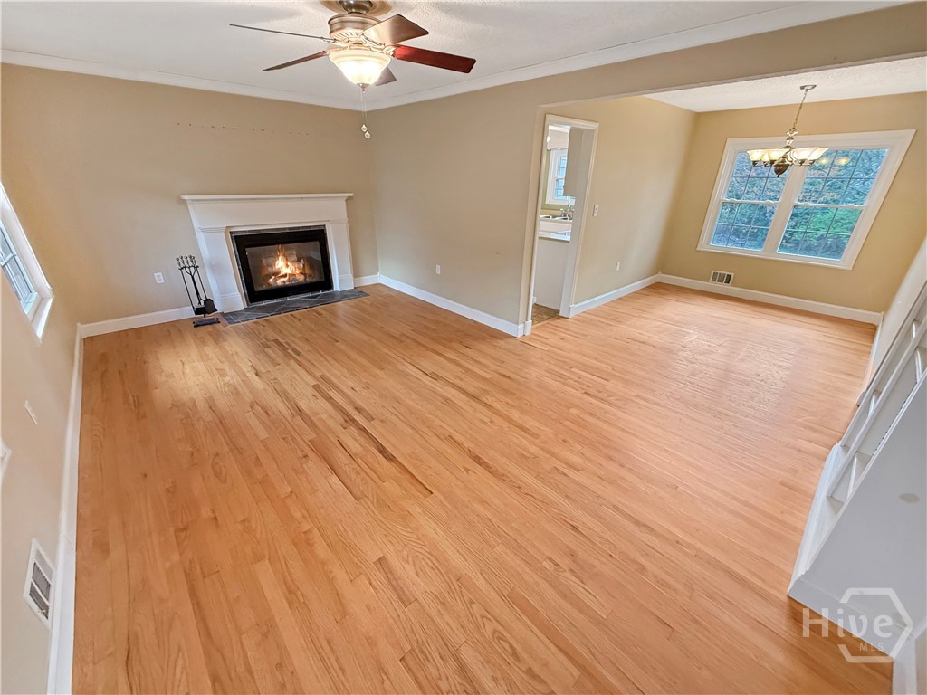 Great Room with fireplace and hardwood floors
