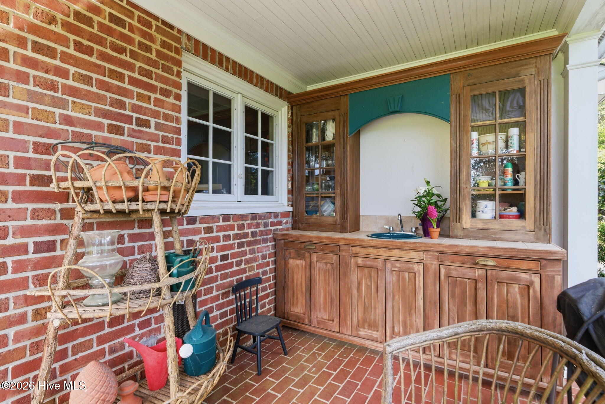 Custom built-in cabinetry with sink side porch