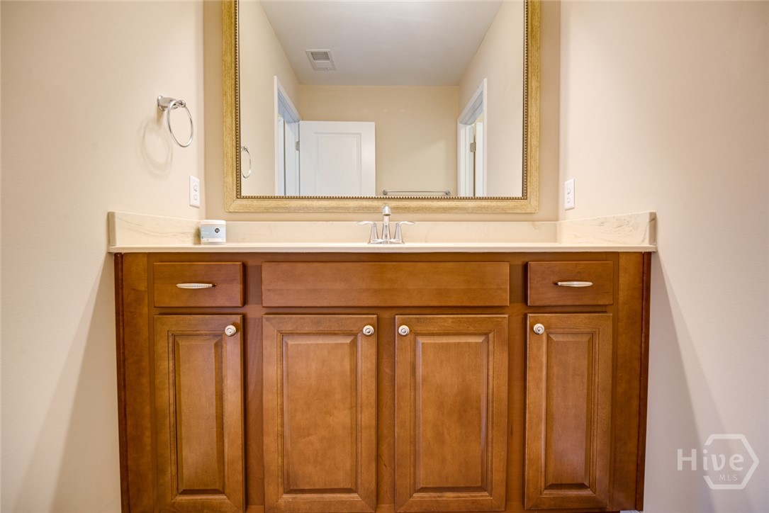 large vanity in secondary bath. Room for all of your self-care goodies