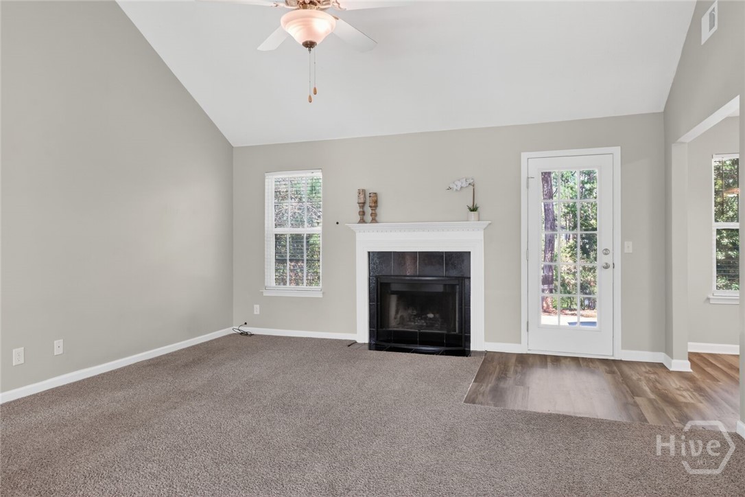 Family room with fireplace and vaulted ceiling